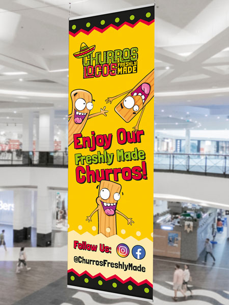 A bright yellow hanging banner design for a churros vendor
